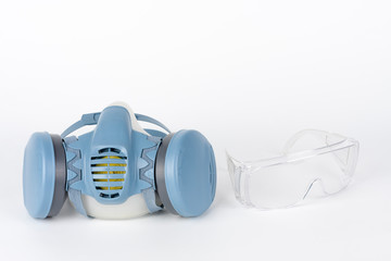 Twin filter half face respirator mask and plastic protective eyglasses,  personal protective equipment to protect against the virus covid-19.
