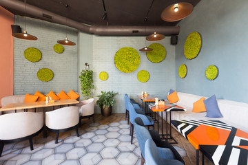 Cozy cafe interior with empty places for eating and resting