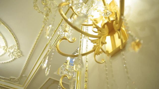 A beautiful Chandelier at a Restaurant. Could also be the Interior of a classy Bar or a Living Room.
