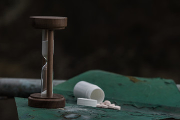 White pills on metal stand