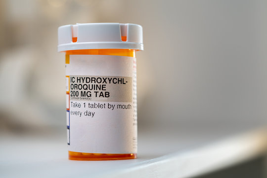 Hydroxychloroquine (Chloroquine) Pills, prescription bottle for possible (Unproven) Treatment To COVID-19. Generic drug for Plaquenil On white Background