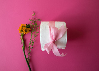 Toilet paper & flowers wrapped like a gift 