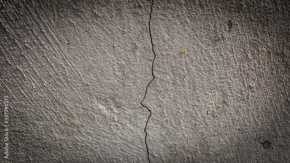 Poster old stone wall with a crack. texture for design