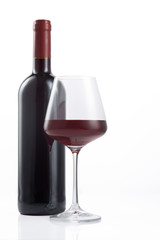 Bottle and glass of Spanish red wine on  white background