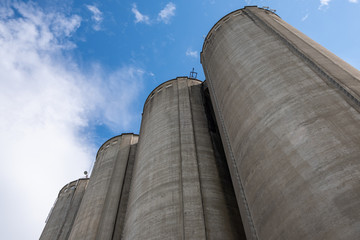 Cement silo towers represent data silos in computer science, which isolate data since the only access gate to the data is a single application © Barnabas