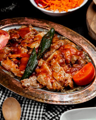 turkish chicken kebab with mashed aubergine garnished with tomato sauce
