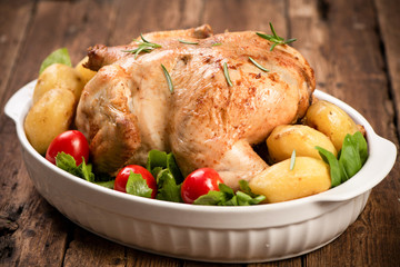 Roasted turkey garnished with potato and veg. Thanksgiving Christmas dinner. Chicken, roasted