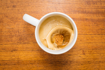 cup of coffee and amaretti in freeze frame 