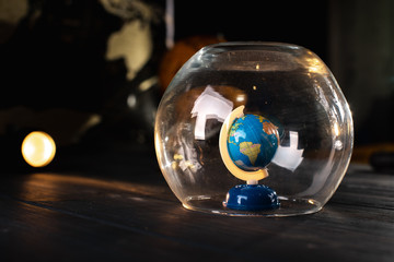 Earth under a glass bell. Quarantine, pandemic concept in the world COVID-19