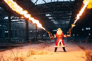 Deurstickers Santa Claus with flamethrowers in an abandoned warehouse © slava33511