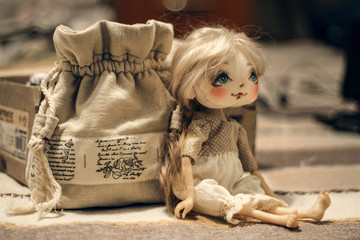 small doll and handmade handbag