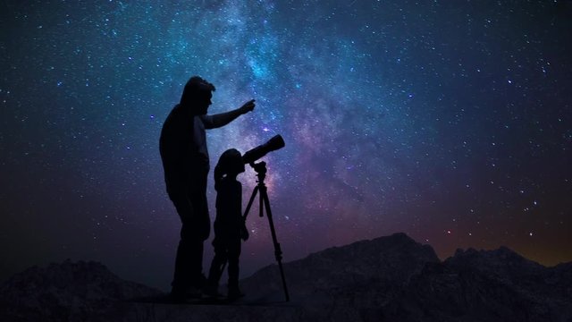 Man Father With Daughter Child Photographs And Observes Night Starry Sky
