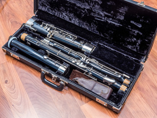 Old used bassoon parts unassembled in the case