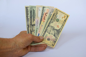 Banknotes of different countries and denominations in the form of a fan, the concept of a game on...