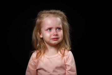 The Little Girl Is Crying Loudly, She Is Very Upset, She Is Hysterical. She Can't Calm Down. Photo...
