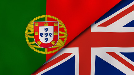The flags of Portugal and United Kingdom. News, reportage, business background. 3d illustration