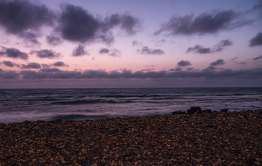 Waves on the Atlantic Ocean at sunrise. Caleta de La Guirra Beach, Fuerteventura, Canary islands, Spain. October 2019