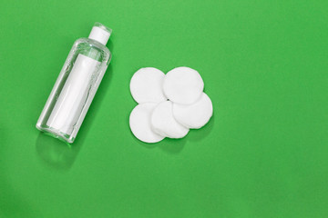 Makeup remove skin care. Tonic for face skin or makeup remover in a plastic bottle, cotton pads and...