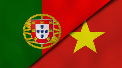 The flags of Portugal and Vietnam. News, reportage, business background. 3d illustration