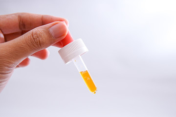 dripping the vaccine using a medical pipette isolated white background