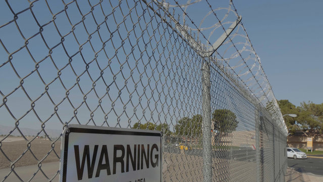 Barb wire on the top of a fence - USA 2017