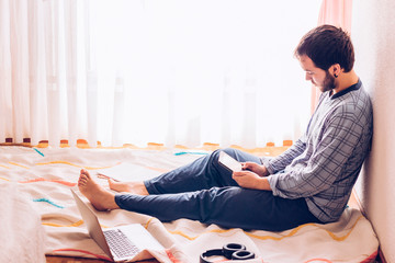 boy sitting on the floor with tablet