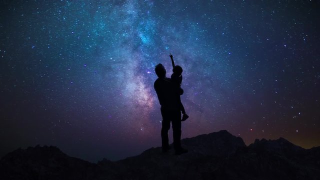 Man Father Showing Daughter Child Night Starry Sky In Mountains