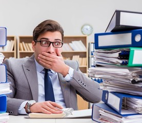 Fototapeta premium Busy businessman under stress due to excessive work