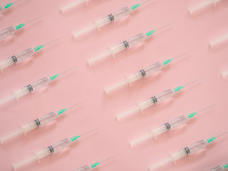 Syringe pattern on pink background