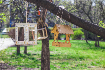 Bird feeders. Children made and hung bird feeders near the school. Bird feeders in early spring.