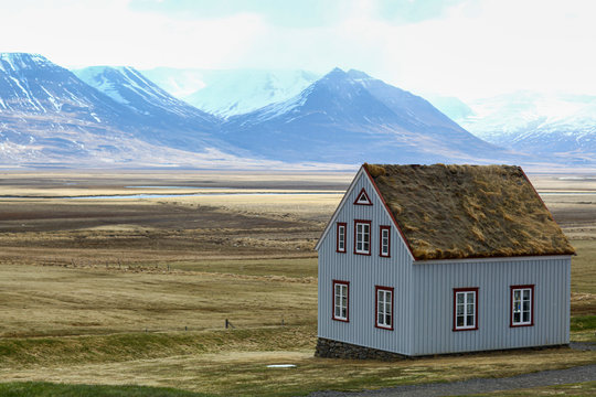 rural houses with a roof made of grass. The Icelandic landscape