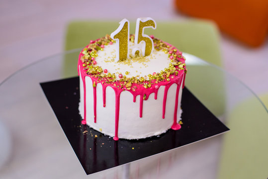 15th birthday cake party with pink glaze and nuts