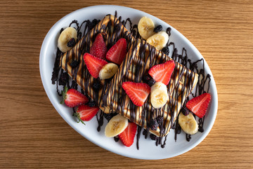 waffles with strawberries, mullberries and bananas