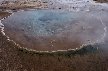 The Thermal vents located all around the Stokkur Geyser area in Iceland with the deep blue vents going deep underground