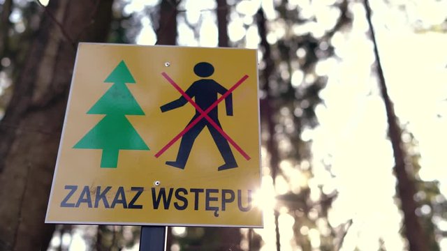 Return of communism in Poland. Information plate with a sign prohibiting entry into the forest. The ban does not comply with the Polish constitution.  PIS violates human rights during the coronavirus 