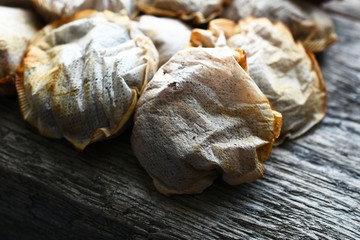 A close up image of several used tea bags. 