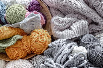 Different yarn for knitting in pastel and bright colors.