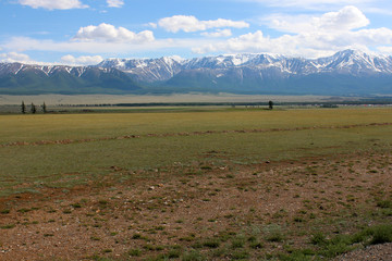 Steppe and mountains with snowy peaks