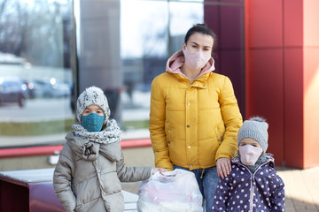 Mom and kids are shopping at the grocery store.