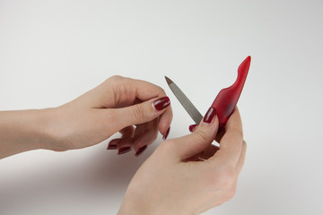 Woman caring for her nails on her own. Manicure