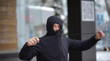Close-up portrait of a middle-aged man in a tightened hood