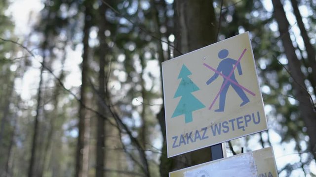 Return of communism in Poland. Information plate with a sign prohibiting entry into the forest. The ban does not comply with the Polish constitution.  PIS violates human rights during the coronavirus 