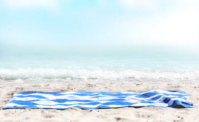 Beach towel on sen sea view, empty space advertisement display,summer backdrop.