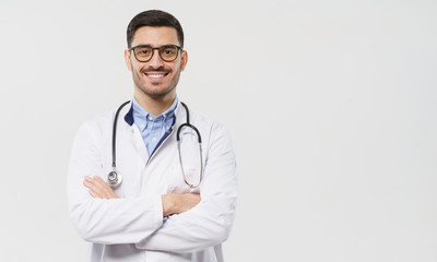 Horizontal banner of smiling young doctor ready to help patients with health problems, isolated on gray background with copy space on right side