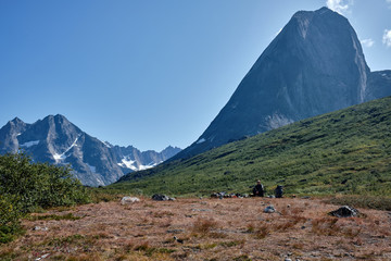 Man sitting in mountain landscape in the mountains 