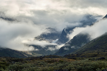 Fototapeta na wymiar Mountains with cloud or fog covering 
