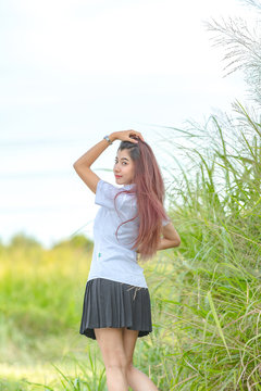 Portrait Of Asian Or Thai Student University Uniform Beautiful Girl Relax And Smile