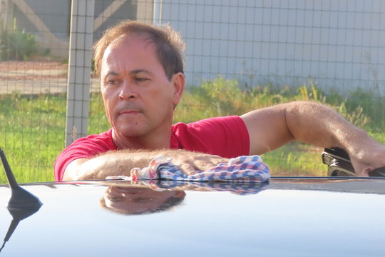 Senior Man Washing The Car