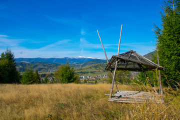 
autumn mountains dry grass on the slopes and blue sky