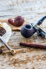 tools for the pleasure of slow smoking, pipe, cigar, tobacco.